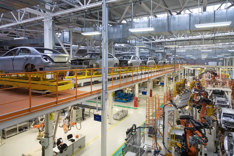 Assembly line with AGV and tugger traffic